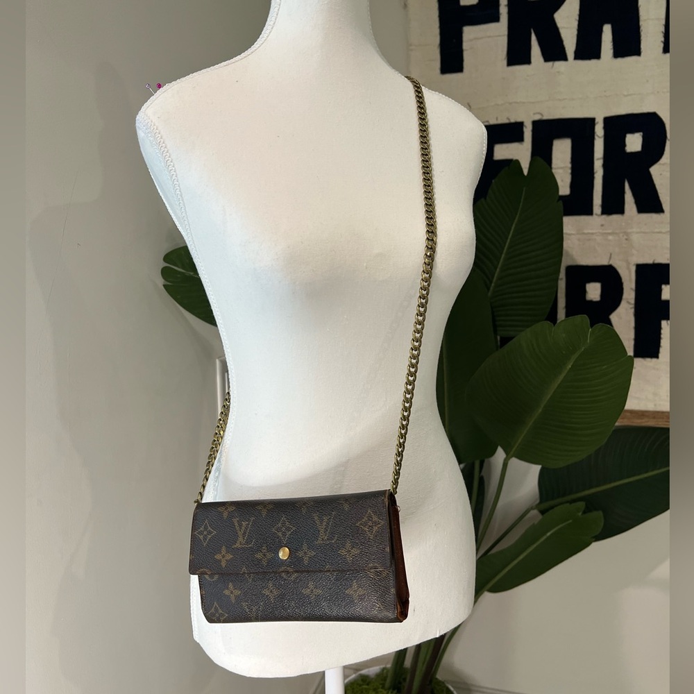 LOUIS VUITTON ‘PORTE TRESOR’ MONOGRAM INTERNATIONAL LONG WALLET.